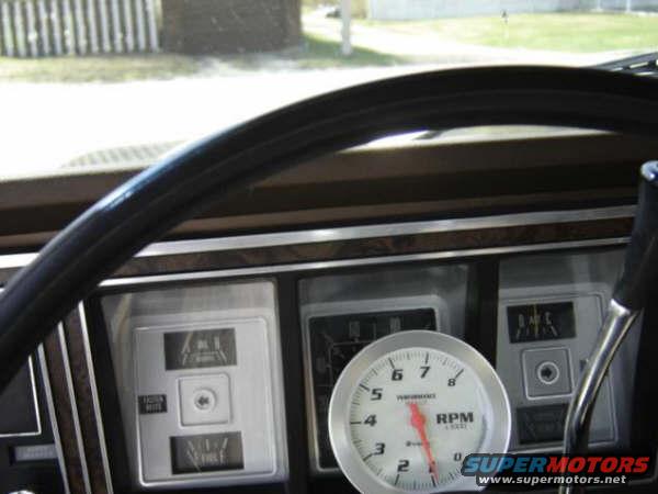 1979 Ford Bronco interior dashboard showing steering wheel, tachometer, and gauges