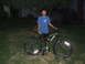 1988 Ford Bronco - A boy poses with his bicycle in a yard at night, with a tree overhead.
