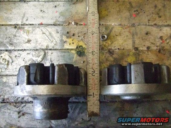 Two rubber and metal suspension parts side-by-side with a ruler for scale