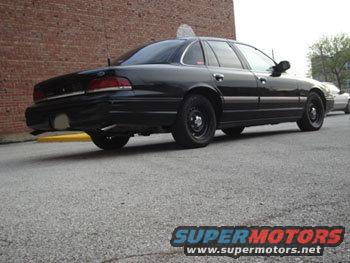 Black 1992 Ford Crown Victoria sedan, rear 3/4 view