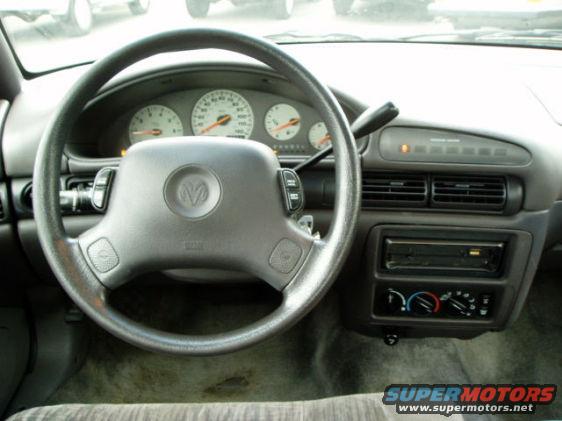 dashboard.jpg Picture of identical car, dashboard. (Ours has no message center, Sony brand stereo instead of whatever brand that is shown)