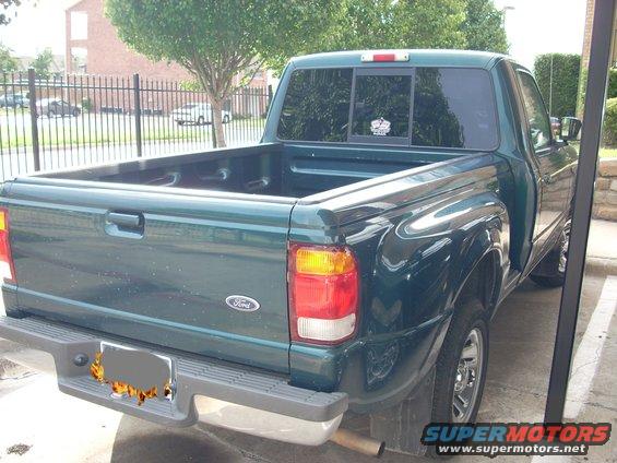Green 1998 Ford Ranger pickup truck rear view