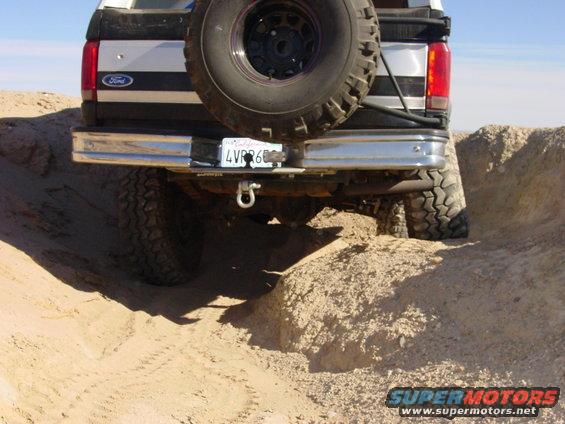 1994 Ford Bronco rear, spare tire mounted, driving off-road on dirt