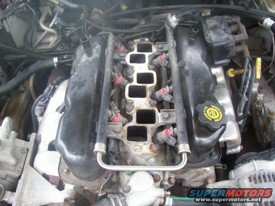 100_0542.jpg Intake manifold/top of engine with plenum removed.