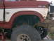 1986 Ford Bronco - This red and white Ford Bronco shows body style cues from the early 1980s, not 1986.