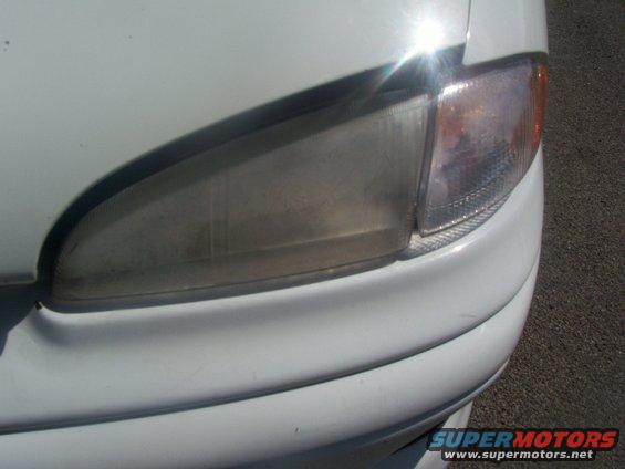 100_0569.jpg Driver's side headlight.