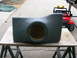 2000 Ford Excursion - A custom-made speaker enclosure is displayed outdoors, with a small red toy Jeep visible behind it.