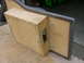2000 Ford Excursion - A custom wooden enclosure is bolted to a vehicle's interior door panel.
