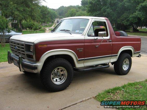 Maroon and white Ford Bronco parked on a driveway