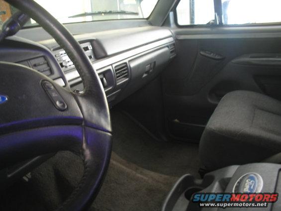 1992 Ford Bronco interior showing dashboard, steering wheel, and passenger seat