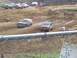 2001 Dodge 1500 - Vehicles compete in a mud race event, with spectators and other vehicles in the background.