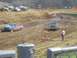 2001 Dodge 1500 - Trucks compete in a mud race, navigating a challenging dirt track.