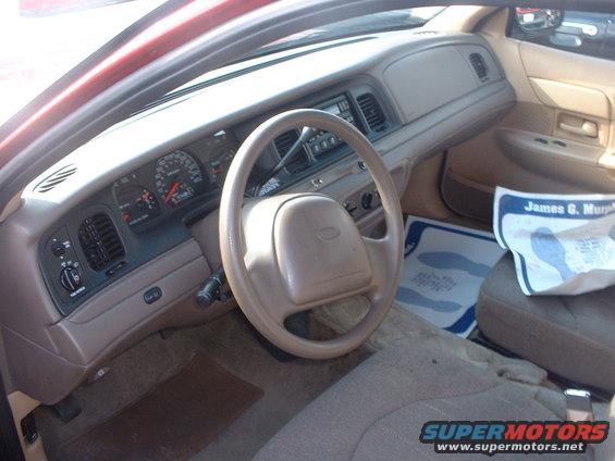 Interior view of a 2000 Ford Crown Victoria, showing dashboard and steering wheel