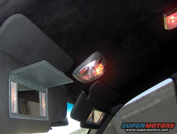 Red Dome Lights and Rainbow Color Changing Map Lights.
MGM Deluxe Lighted Visors and Black Leather Sued Headboard Liner. Getting Pimpish.