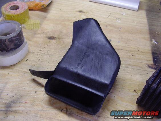 THIS IS WHATS LEFT OF THE INTAKE.  i CUT A PORTION OF IT OFF WITH DREMEL, BECAUSE I WANTED TO KEEP THE STOCK FEE INTO THE AIR BOX, AND BY RUNNING IT THROUGH THE FENDER WELL, I GOT A KIND OF NICE AIR FEED.