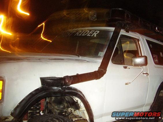 snorkel-013.jpg THE FINISHED PRODUCT.  uSED THREE INCH PVC, HAD TO USE A REDUCER  AND A RECTANGLE TO ROUND GUTTER CONVERTER TO FIT IN THE INTAKE.  SEALED UP WITH SILICONE.  USE RADIATOR CLAMPS TO SECURE TO BODY.  TO SAVE ANYBODY A LITTLE HASSLE, THE JOINT FRONT HORIZONTAL TO VERTICAL IS 45*.  NOW I GOTTA FIGURE OUT SOME KIND OF TOPPER.