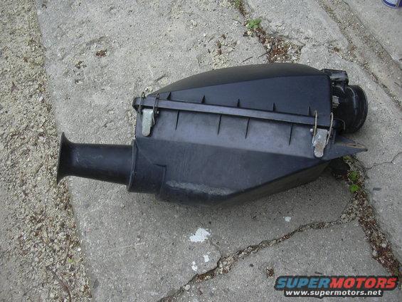 Black plastic air cleaner housing with intake tube