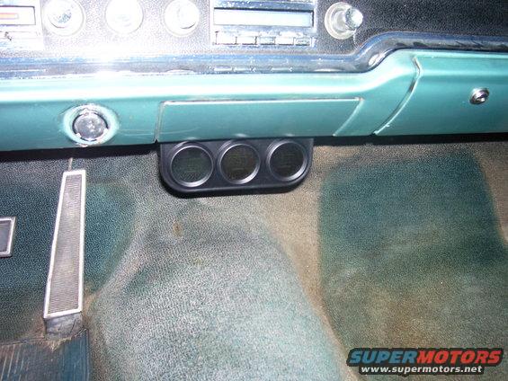 1965 Pontiac Catalina interior with triple gauge pod below dashboard