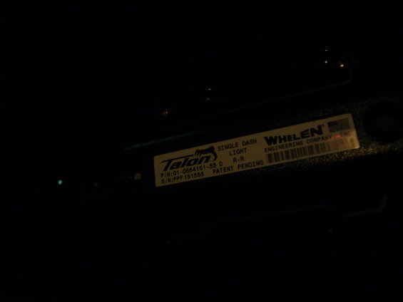 Label on a Whelen Talon single dash light showing part number 01-0664151-55 and serial number PPF151555