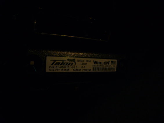 Close-up of a Talon single dash light with Whelen Engineering Company label