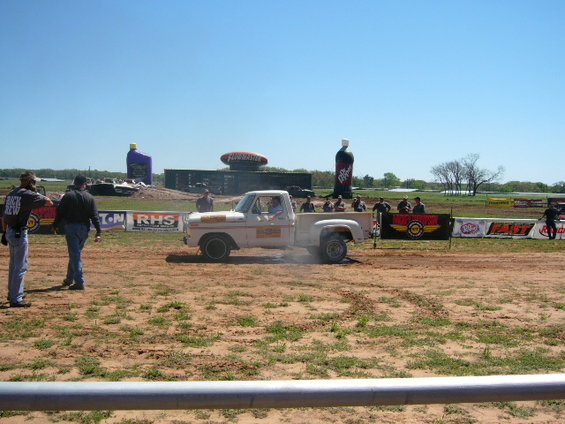 White 1978 Ford F-150 Stepside doing a burnout