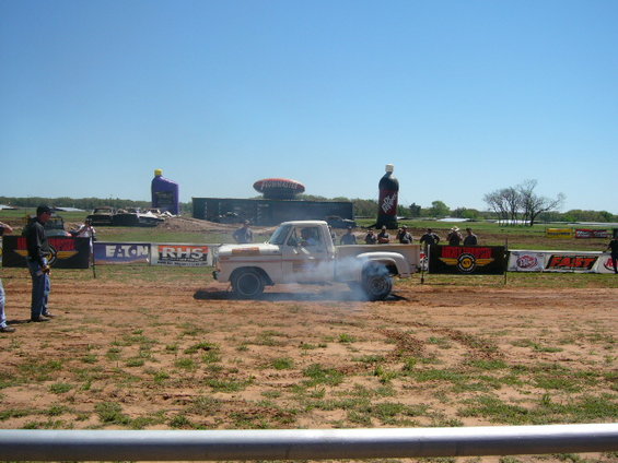1978 Ford F-150 pickup truck doing a burnout, smoke coming from rear tires