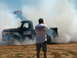1978 Ford Bronco - A vintage pickup truck performs a burnout, enveloped in a cloud of smoke, while a photographer captures the moment.
