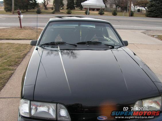 Front view of a black 1988 Ford Mustang parked on a street