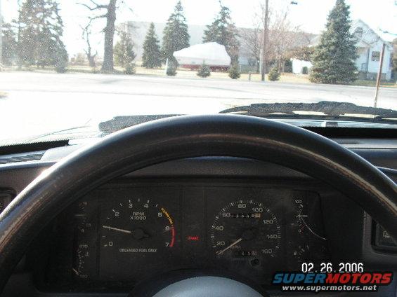 1988 Ford Mustang interior showing dashboard gauges and steering wheel. Date stamp 02.26.2006