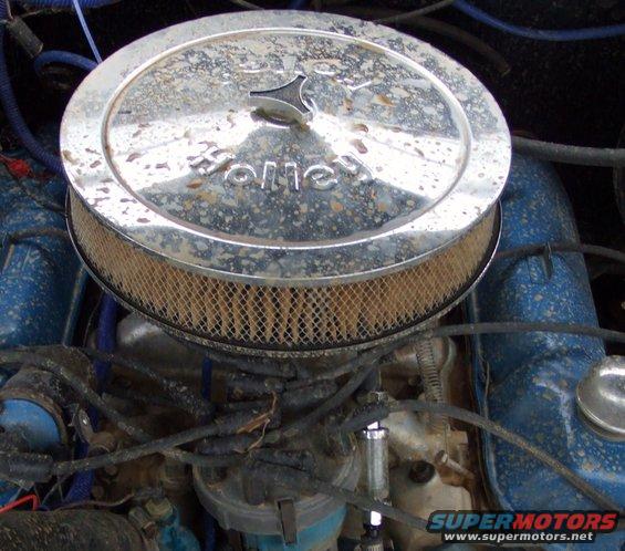 Chrome air cleaner with 'Holley' logo on top of engine components