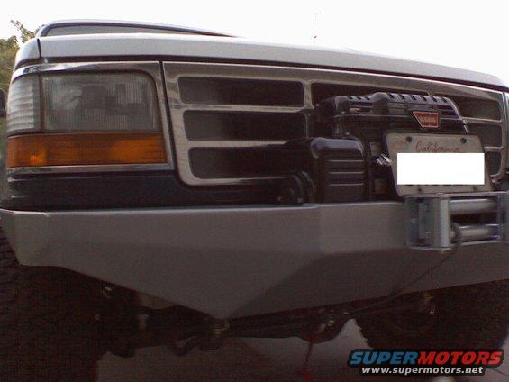 1994 Ford Bronco front end with aftermarket bumper and Warn winch mounted behind grille