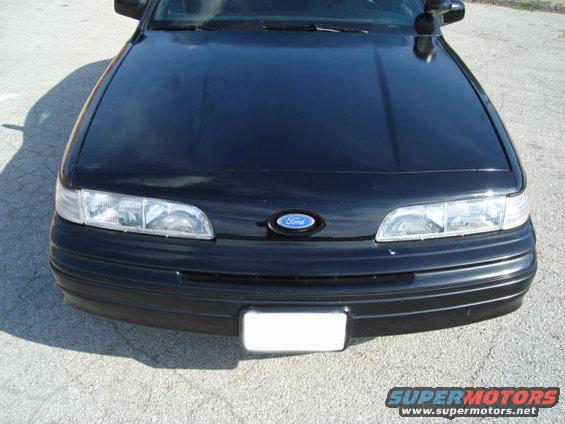 Black 1992 Ford Crown Victoria front view, showing headlights, grille with Ford emblem, and bumper
