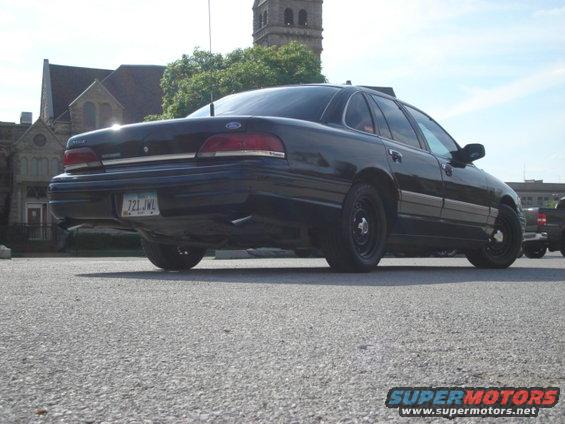 1992 Ford Crown Victoria rear view, black paint, steel wheels, license plate 721 JWL