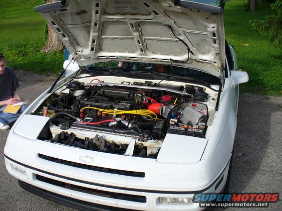 White 1991 Ford Probe engine bay with aftermarket air intake