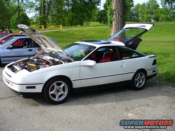 1991 Ford Probe, white, hood and trunk open, red interior, parked outdoors with other cars