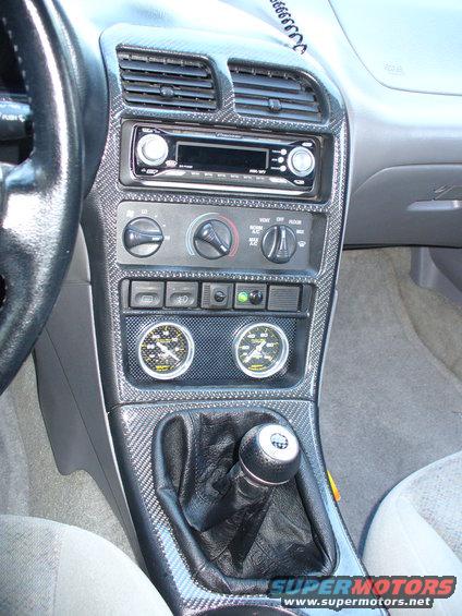 1991 Ford Probe interior showing dashboard with aftermarket gauges and carbon fiber trim