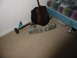 1995 Ford Thunderbird - Car headlights are shown on a carpeted floor next to a guitar and a bed.