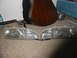 1995 Ford Thunderbird - A pair of car headlights are displayed on a carpeted floor, with a guitar and other objects in the background.