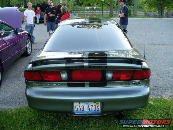 Silver GT car rear view with black stripes and GT badge