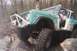 1969 Ford Bronco - This 1969 Ford Bronco is equipped for extreme off-roading, navigating a rocky trail with significant suspension modifications.