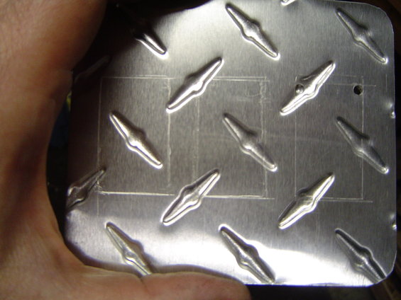 dsc03208.jpg Marked out where the switches go, and drilled holes in the corners