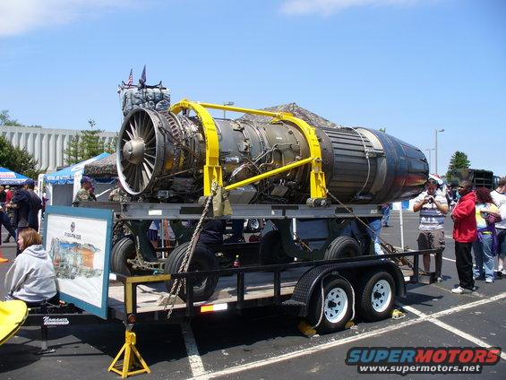 Jet engine on a trailer with people around it