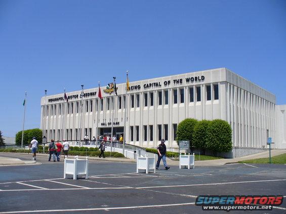 Indianapolis Motor Speedway Hall of Fame building with 'Racing Capital of the World' text above entrance