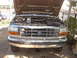 1992 Ford F-350 - Front view of a 1992 Ford F-350 truck with the hood open, revealing the engine compartment and a toolbox.