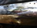 1992 Ford F-350 - Chrome bumper shows dirt accumulation and reflections of the surrounding environment.