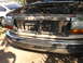 1992 Ford F-350 - The front of a 1992 Ford F-350 truck is shown with its hood open, revealing the engine compartment and radiator.