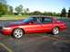 2000 Mercury Grand Marquis - A red 2000 Mercury Grand Marquis sedan is parked in a lot on a sunny day.