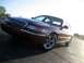 2000 Mercury Grand Marquis - Maroon 2000 Mercury Grand Marquis with chrome grille and aftermarket wheels.