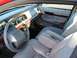 2000 Mercury Grand Marquis - The interior of a 2000 Mercury Grand Marquis features wood trim accents and light tan leather upholstery.