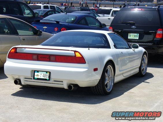 White Acura NSX rear view with custom wheels and aftermarket exhaust